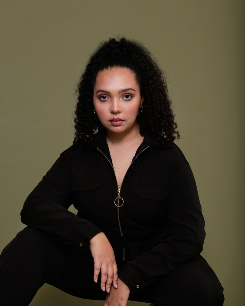 Front of a model wearing a size L (12/14) Malaya Modern Utility Jumpsuit in Black by LuvMeMore. | dia_product_style_image_id:266662